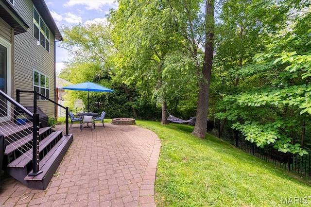 1438 Arbor Green Trl, Ofallon, IL 62269 - view of grassy yard featuring an outdoor fire pit and a patio