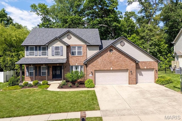 1438 Arbor Green Trl, Ofallon, IL 62269 - view of front of property featuring an attached garage, brick siding, a front yard, concrete driveway, and a shingled roof