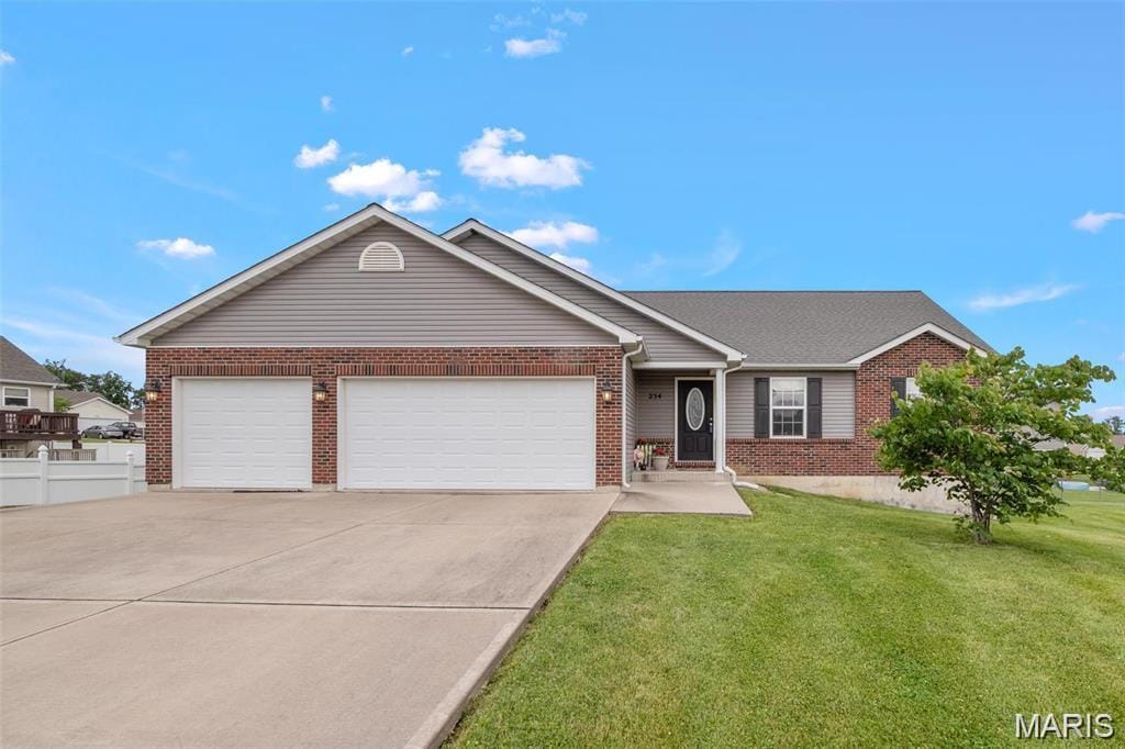 single story home featuring brick siding, an attached garage, and driveway