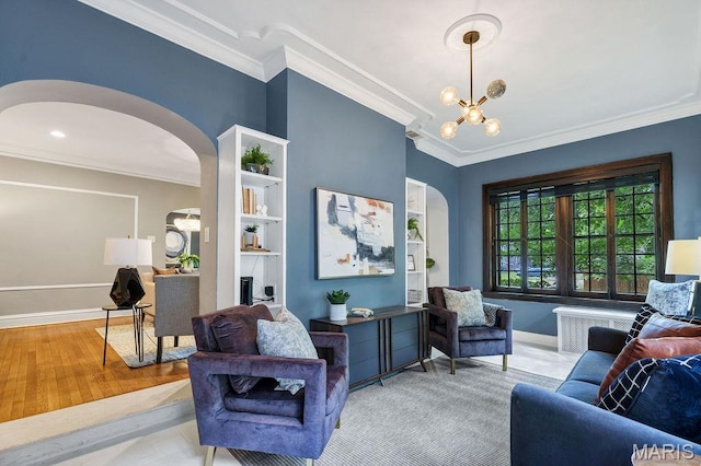 316 Melville Ave, Saint Louis, MO 63130 - living room with arched walkways, ornamental molding, a chandelier, baseboards, and wood finished floors