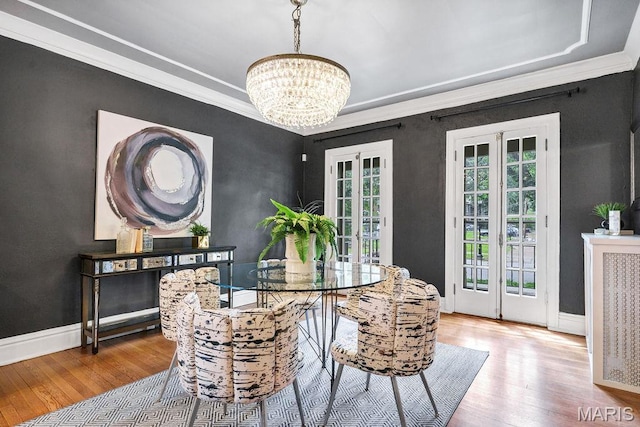 316 Melville Ave, Saint Louis, MO 63130 - dining space with a chandelier, hardwood / wood-style flooring, french doors, and ornamental molding