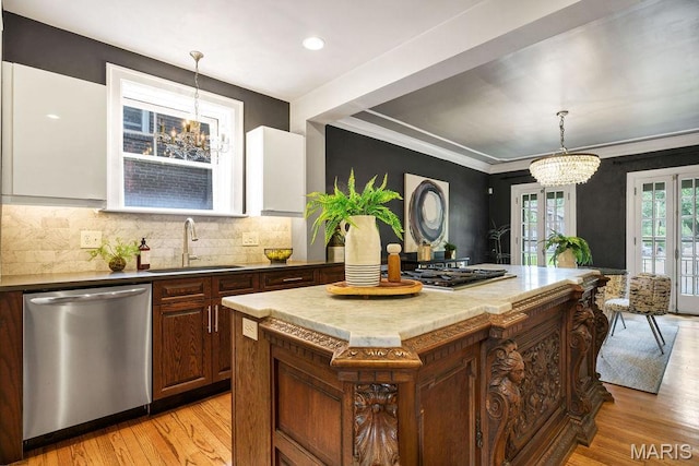 316 Melville Ave, Saint Louis, MO 63130 - kitchen featuring stainless steel appliances, a chandelier, a sink, light wood-style floors, and ornamental molding