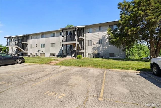 1811 Gascony Parc Dr Unit 1811, Lake St Louis, MO 63367 - view of building exterior featuring uncovered parking and stairway