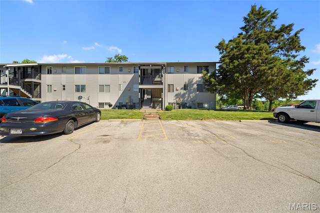 1811 Gascony Parc Dr Unit 1811, Lake St Louis, MO 63367 - view of building exterior with uncovered parking and stairway