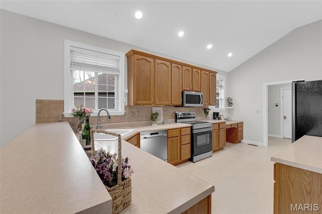1204 Cobblestone Ter, Lake St Louis, MO 63367 - kitchen with appliances with stainless steel finishes, a sink, backsplash, recessed lighting, and light countertops