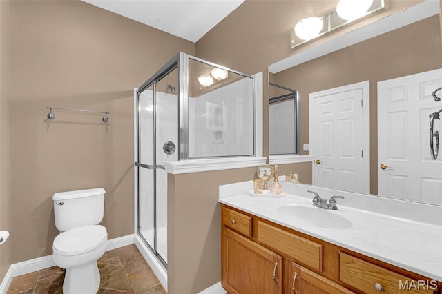 1204 Cobblestone Ter, Lake St Louis, MO 63367 - full bathroom featuring baseboards, a shower stall, toilet, vanity, and stone finish flooring