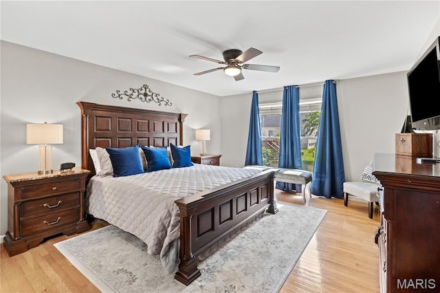 bedroom with light wood-style floors and ceiling fan