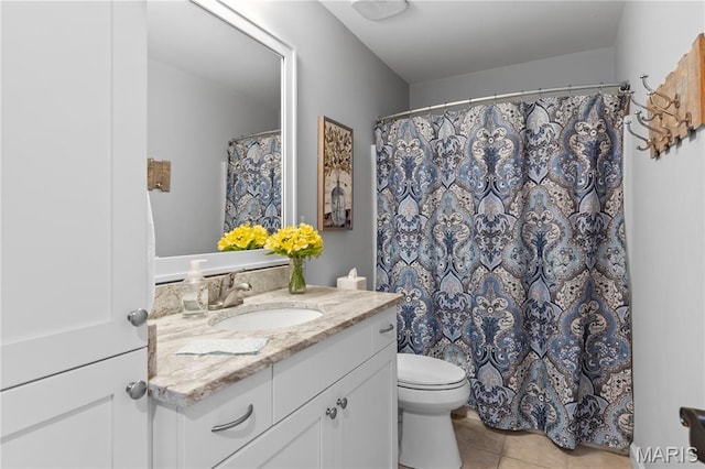full bathroom with tile patterned flooring, vanity, and toilet