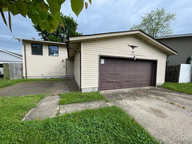 33 Briarcliff Dr, Granite City, IL 62040 - view of front of house featuring fence, driveway, and a garage