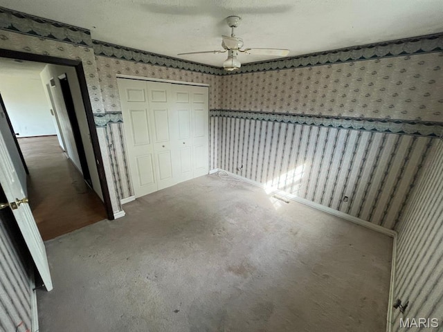 33 Briarcliff Dr, Granite City, IL 62040 - unfurnished bedroom featuring wallpapered walls, a closet, carpet flooring, ceiling fan, and baseboards