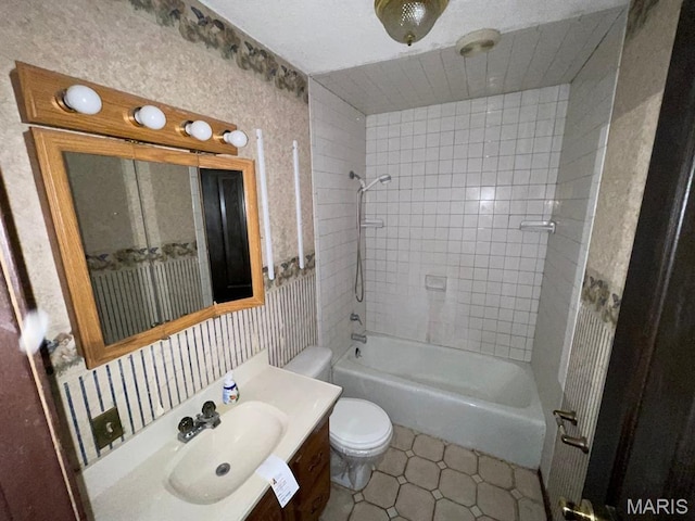 33 Briarcliff Dr, Granite City, IL 62040 - bathroom featuring toilet, vanity, shower / tub combination, tile patterned floors, and wallpapered walls