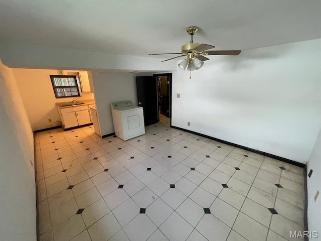 33 Briarcliff Dr, Granite City, IL 62040 - empty room with washer / dryer, a sink, ceiling fan, and baseboards