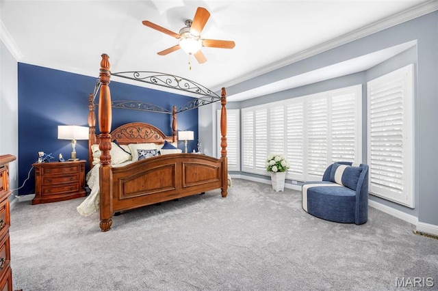 bedroom with crown molding, carpet, baseboards, and ceiling fan