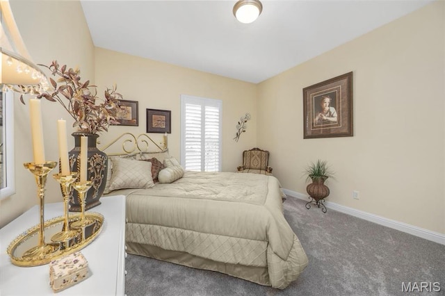 carpeted bedroom with baseboards