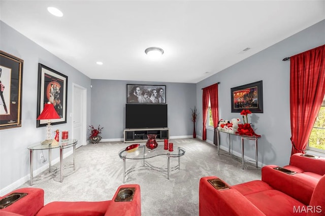 carpeted living area featuring baseboards and recessed lighting