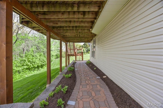 view of grassy yard with stairway