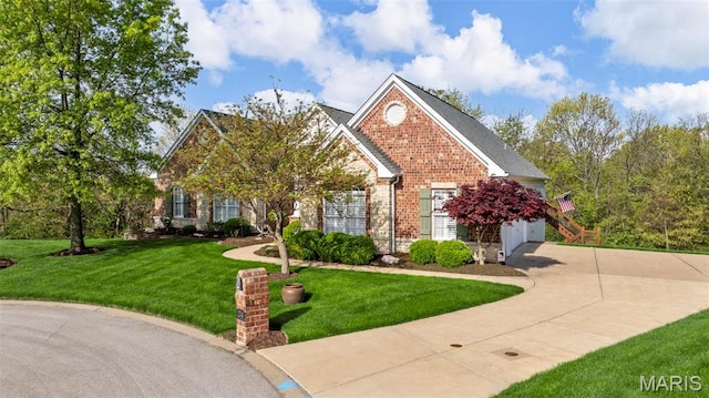 traditional-style home with brick siding, a front yard, and driveway