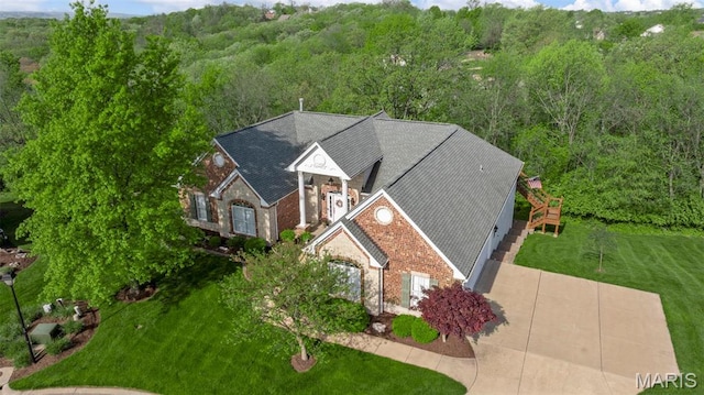 view from above of property with a forest