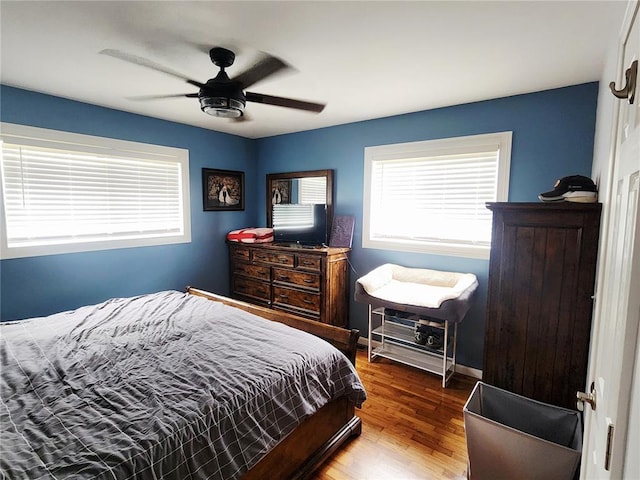 1104 Ringo St, Mexico, MO 65265 - bedroom featuring wood finished floors, ceiling fan, and baseboards