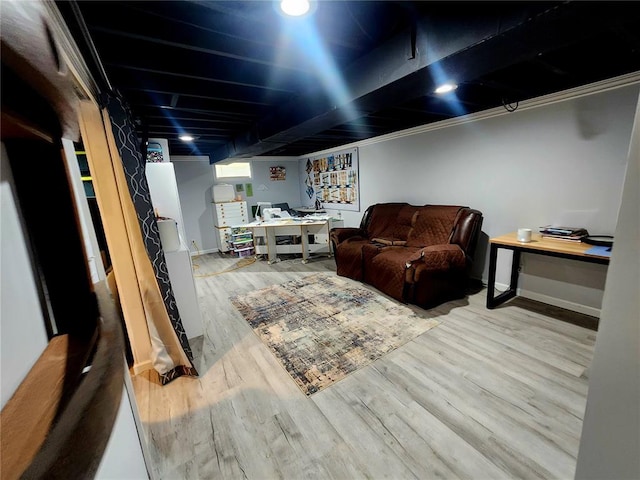 1104 Ringo St, Mexico, MO 65265 - finished basement featuring an office area, wood finished floors, and baseboards
