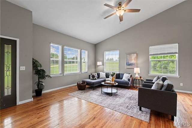 122 Morgan Lake Rd, De Soto, MO 63020 - living area featuring light wood-style flooring, a ceiling fan, baseboards, and high vaulted ceiling
