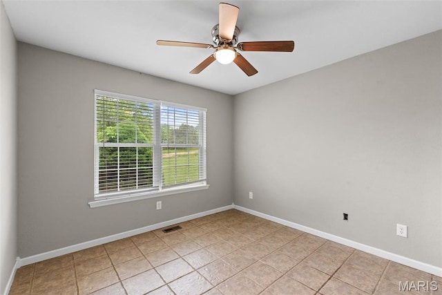 122 Morgan Lake Rd, De Soto, MO 63020 - spare room featuring a ceiling fan, baseboards, and light tile patterned floors