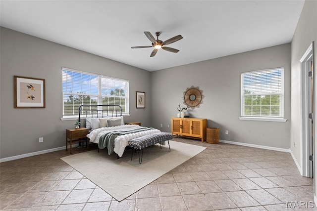 122 Morgan Lake Rd, De Soto, MO 63020 - bedroom featuring multiple windows, baseboards, and a ceiling fan
