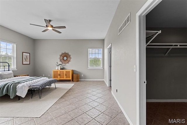 122 Morgan Lake Rd, De Soto, MO 63020 - bedroom with multiple windows, light tile patterned flooring, baseboards, and ceiling fan