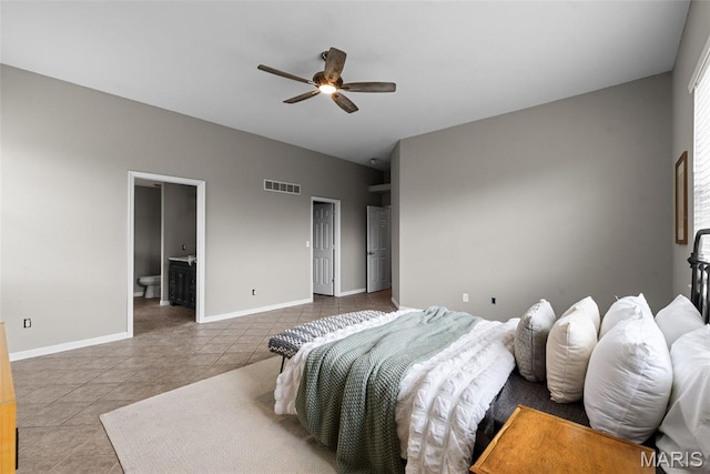 122 Morgan Lake Rd, De Soto, MO 63020 - tiled bedroom with ensuite bath, baseboards, and ceiling fan