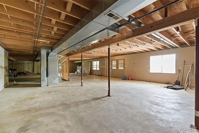 122 Morgan Lake Rd, De Soto, MO 63020 - below grade area featuring plenty of natural light and heating unit