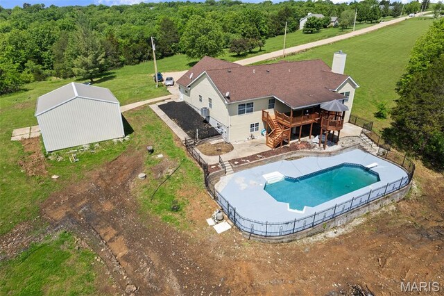 122 Morgan Lake Rd, De Soto, MO 63020 - view of swimming pool with a wooden deck, stairs, and a view of trees