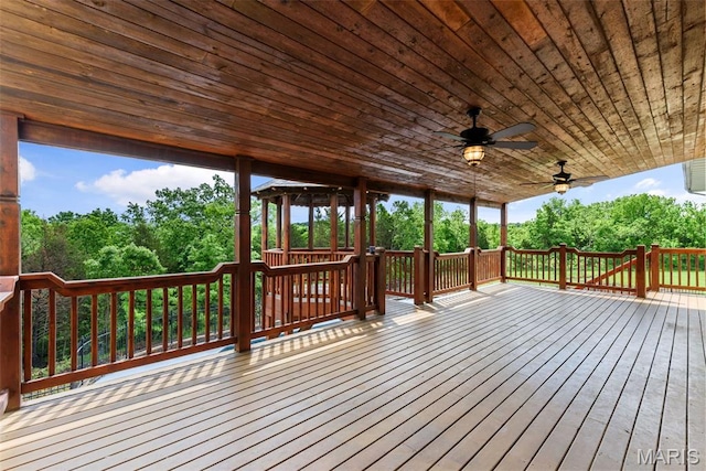 122 Morgan Lake Rd, De Soto, MO 63020 - deck featuring a ceiling fan and view of scattered trees