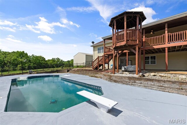 122 Morgan Lake Rd, De Soto, MO 63020 - view of pool featuring stairway, a diving board, a deck, and a patio