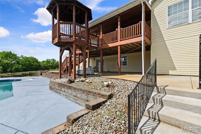 122 Morgan Lake Rd, De Soto, MO 63020 - back of house featuring a patio area, stairway, and a wooden deck