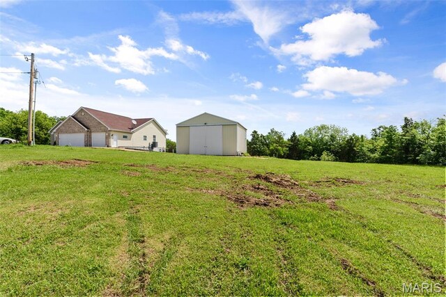122 Morgan Lake Rd, De Soto, MO 63020 - view of green lawn with an outbuilding and a garage