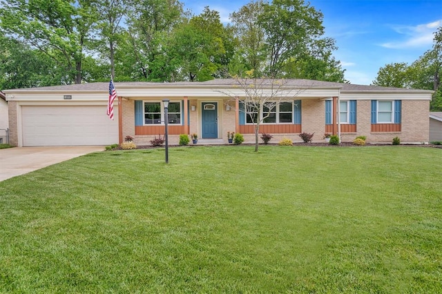 single story home featuring brick siding, an attached garage, driveway, and a front yard