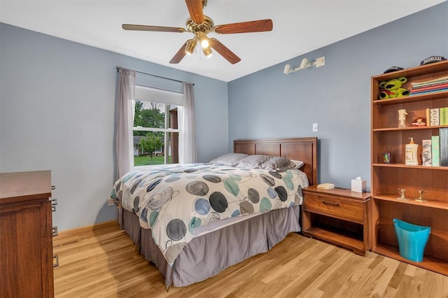 bedroom with wood finished floors and ceiling fan