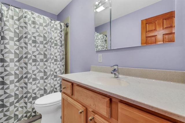 full bathroom with vanity, toilet, and a shower with shower curtain