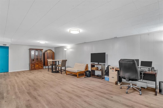 home office with wood finished floors
