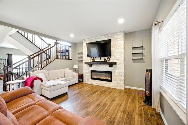 491 Cypress Creek Ln, Imperial, MO 63052 - living room featuring stairway, baseboards, wood finished floors, and a stone fireplace