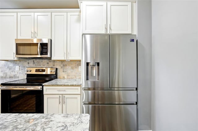 491 Cypress Creek Ln, Imperial, MO 63052 - kitchen featuring appliances with stainless steel finishes, decorative backsplash, and white cabinetry