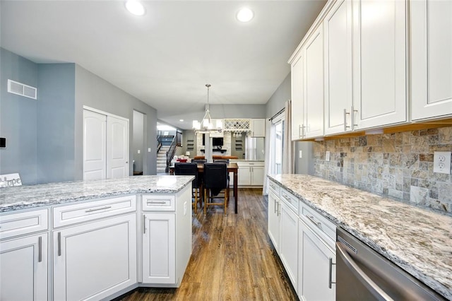 491 Cypress Creek Ln, Imperial, MO 63052 - kitchen featuring stainless steel dishwasher, a chandelier, dark wood finished floors, white cabinets, and recessed lighting