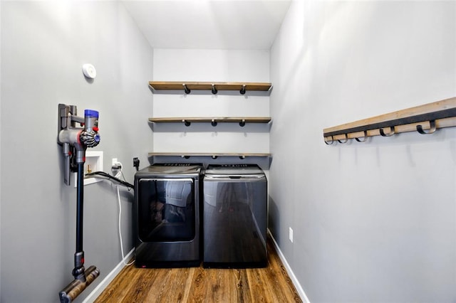 491 Cypress Creek Ln, Imperial, MO 63052 - laundry area featuring washing machine and clothes dryer, wood finished floors, and baseboards