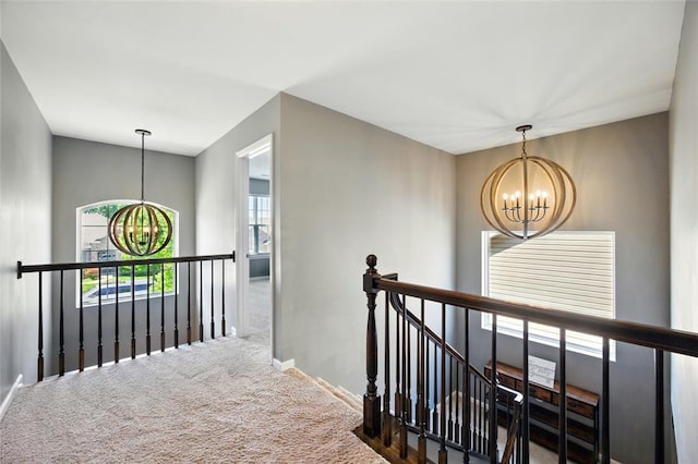 491 Cypress Creek Ln, Imperial, MO 63052 - corridor featuring a chandelier, an upstairs landing, carpet floors, and plenty of natural light