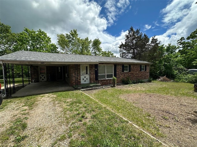 16864 State Highway 32, Bismarck, MO 63624 - single story home featuring dirt driveway, an attached carport, brick siding, and a front yard