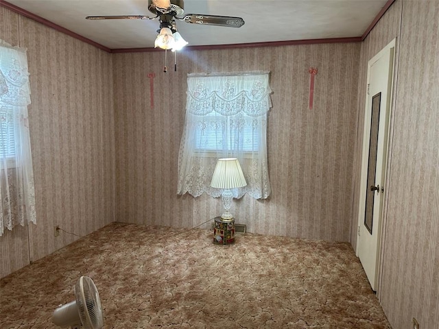 16864 State Highway 32, Bismarck, MO 63624 - spare room featuring a ceiling fan, crown molding, and carpet