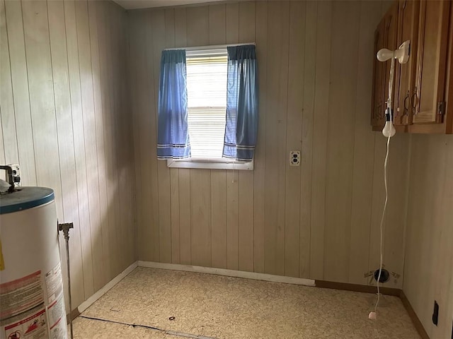 16864 State Highway 32, Bismarck, MO 63624 - unfurnished room featuring gas water heater, baseboards, and wooden walls