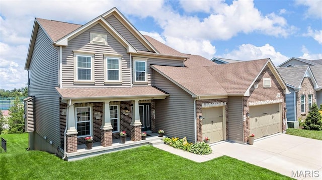137 Countryshire Dr, Lake St Louis, MO 63367 - craftsman-style house with a porch, a garage, a front yard, and driveway