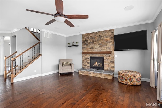 137 Countryshire Dr, Lake St Louis, MO 63367 - living room featuring ceiling fan, stairs, wood finished floors, ornamental molding, and a fireplace