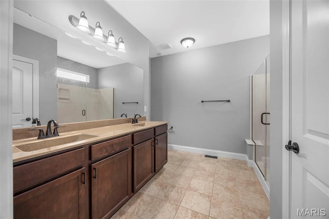 137 Countryshire Dr, Lake St Louis, MO 63367 - bathroom featuring double vanity, a stall shower, and baseboards